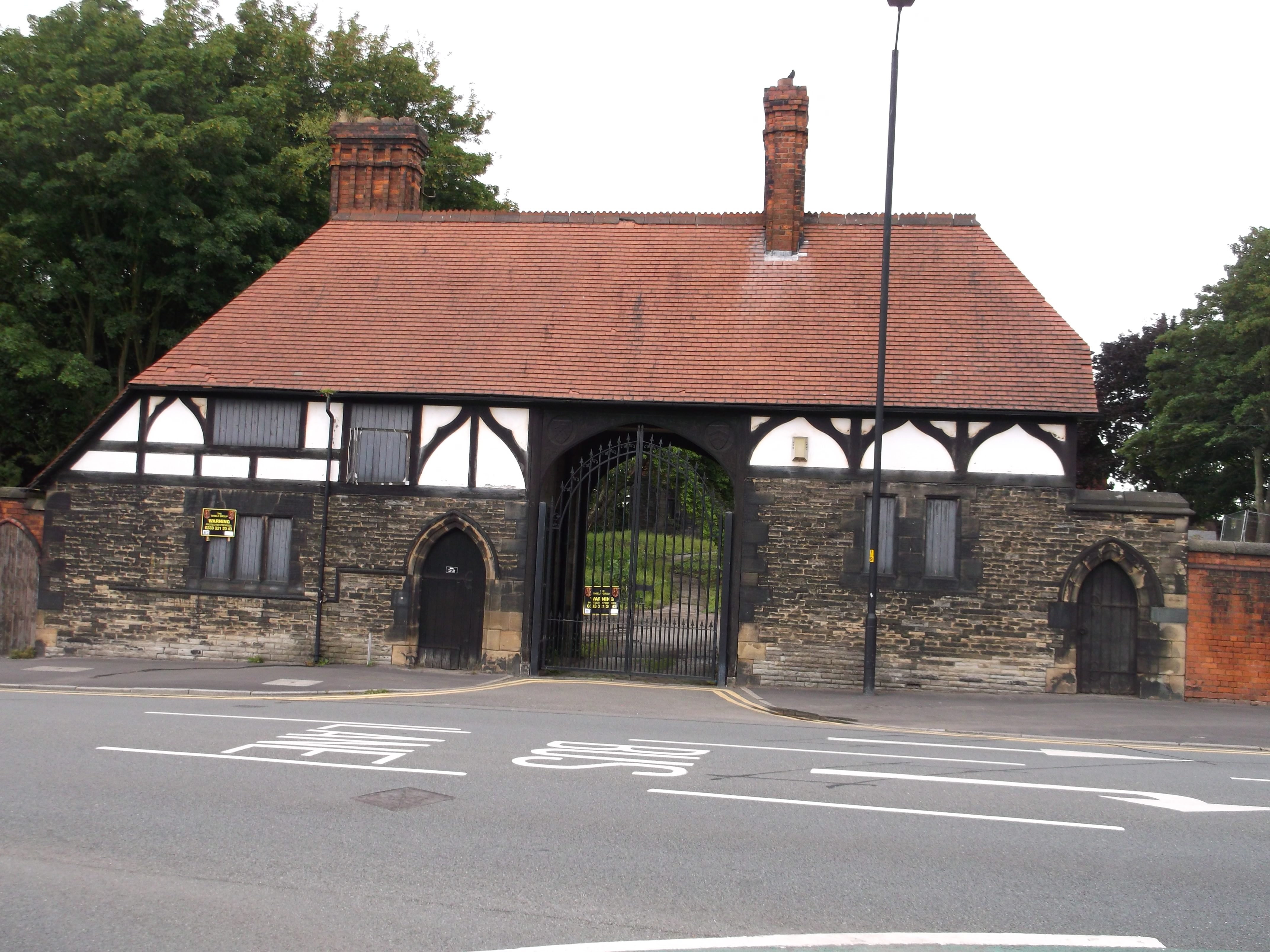 Gatehouse to Wigan Hall with attached boundary wall